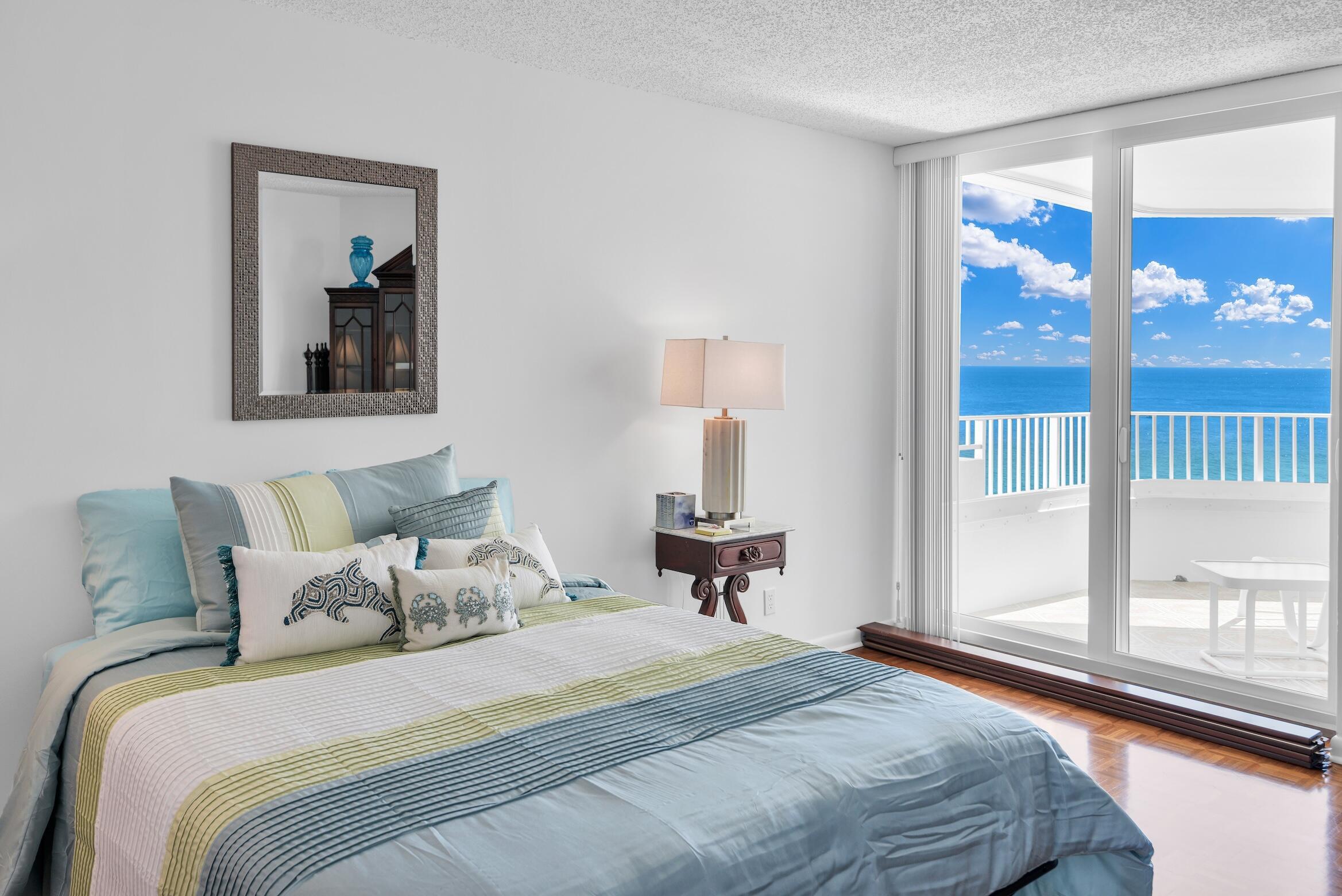 500 South Ocean Boulevard, Unit 1006 Boca Raton, FL 33432 - Photo 21 of 40 a bedroom with a large bed and a window