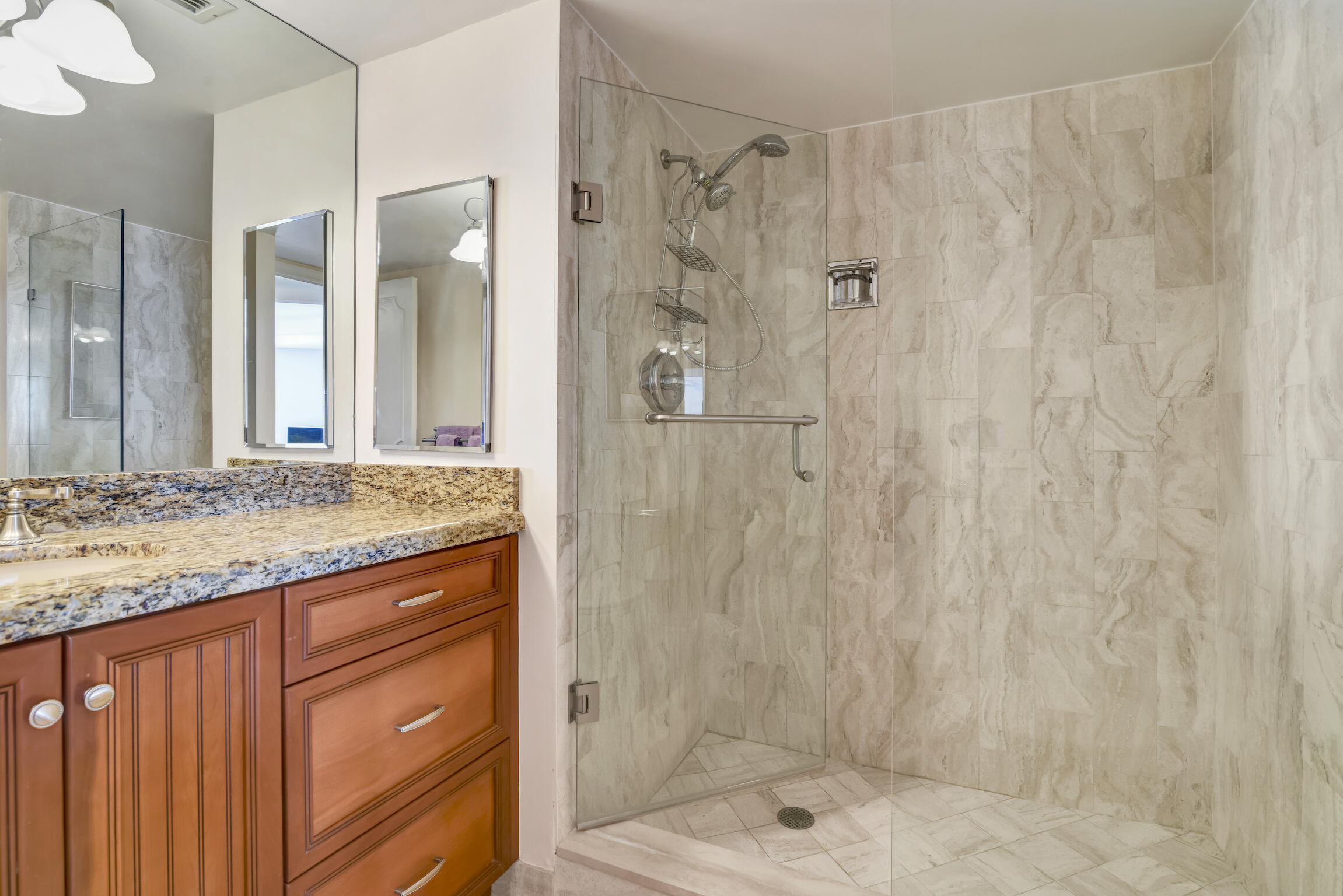 500 South Ocean Boulevard, Unit 1006 Boca Raton, FL 33432 - Photo 22 of 40 a bathroom with a granite countertop sink and shower