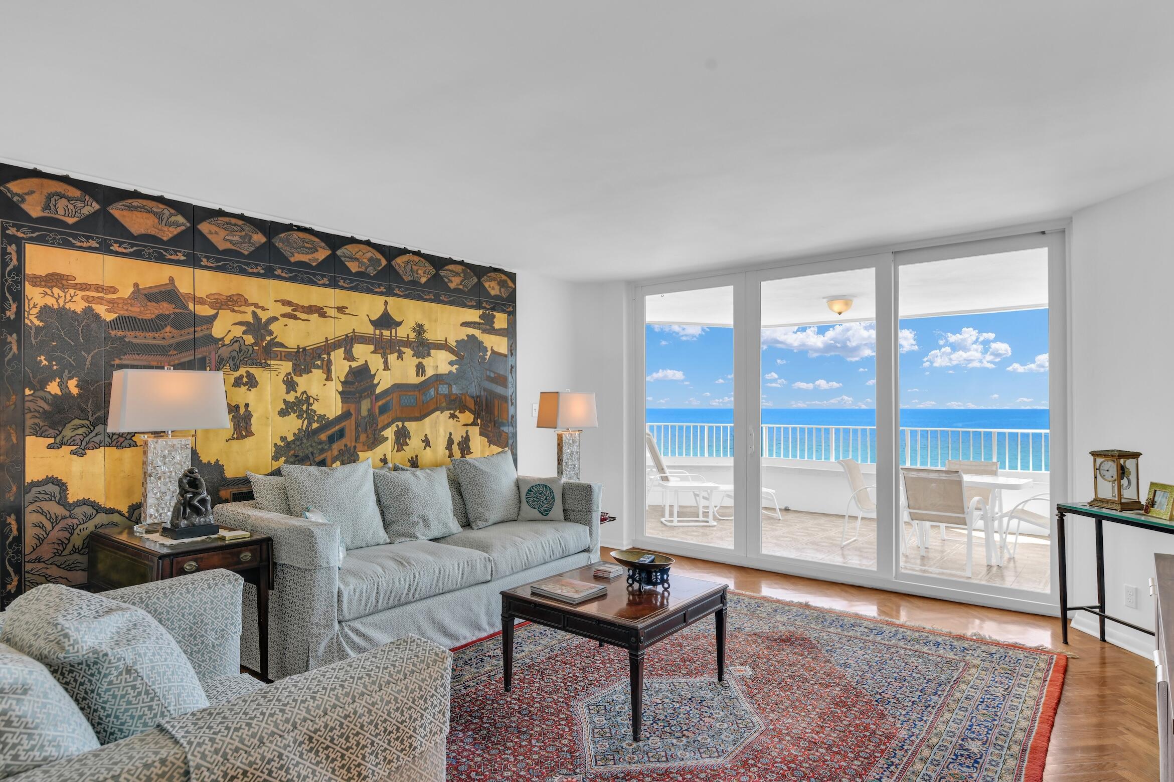 500 South Ocean Boulevard, Unit 1006 Boca Raton, FL 33432 - Photo 3 of 40 a living room with furniture and a floor to ceiling window