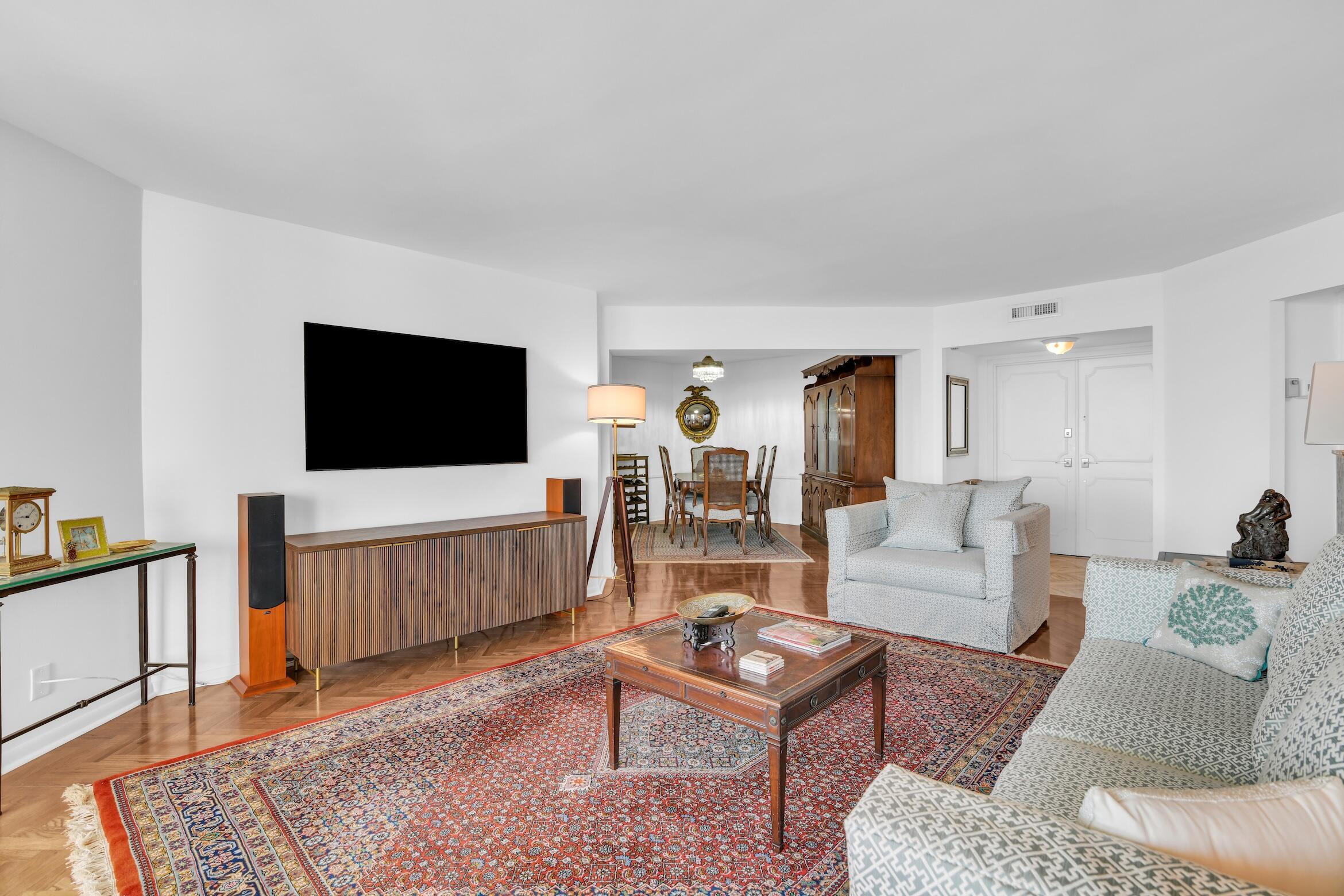 500 South Ocean Boulevard, Unit 1006 Boca Raton, FL 33432 - Photo 4 of 40 a living room with furniture and a flat screen tv