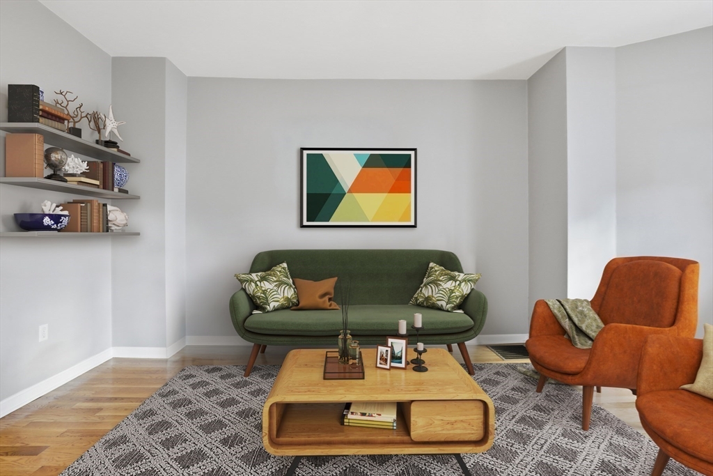 9 Montgomery Avenue, Unit 1 Somerville, MA 02145 - Photo 6 of 27 a living room with furniture and a rug