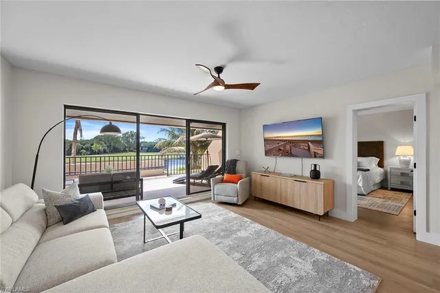 a bedroom with a large bed and a large window