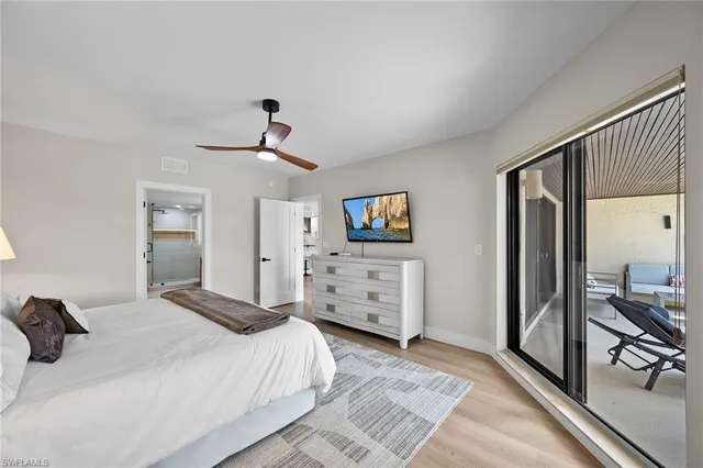 a bathroom with a double vanity sink toilet and shower