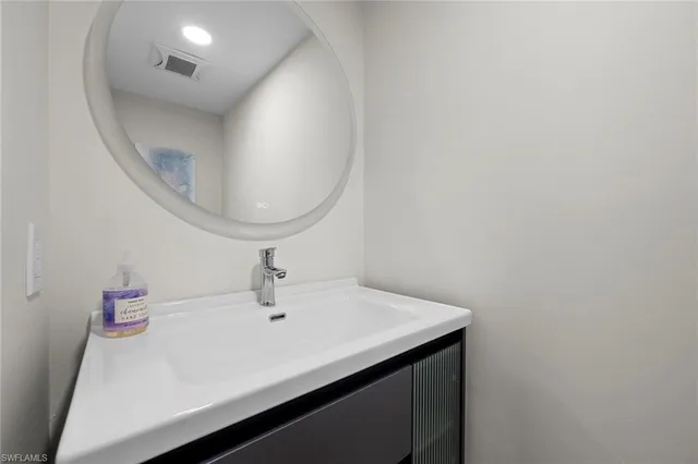 a view of a balcony with a couple of chairs