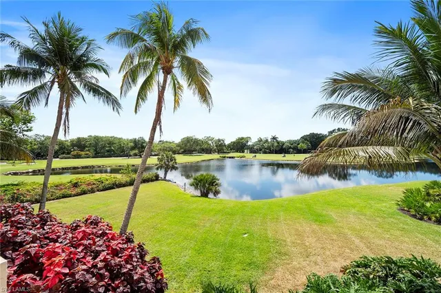 a view of a swimming pool with outdoor seating