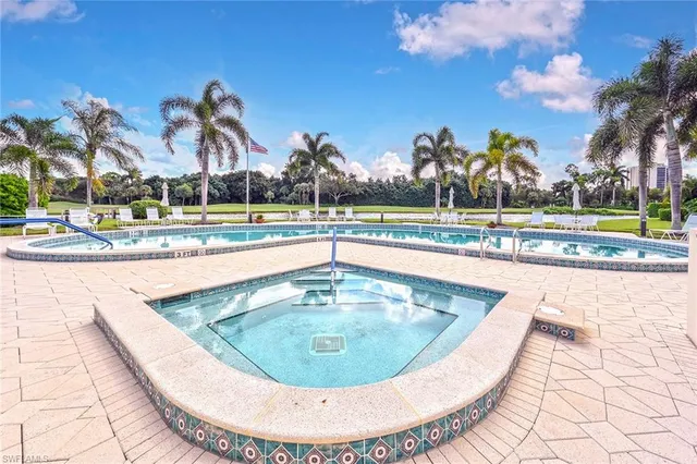 a view of a patio with table and chairs potted plants with sky view
