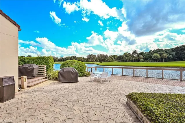 a view of a lake with houses in the background