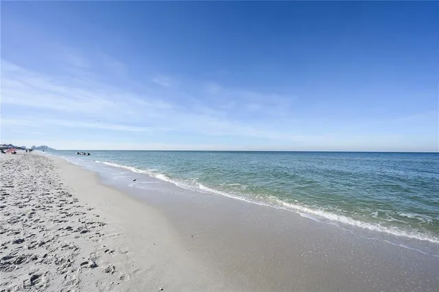 a view of a swimming pool with outdoor seating