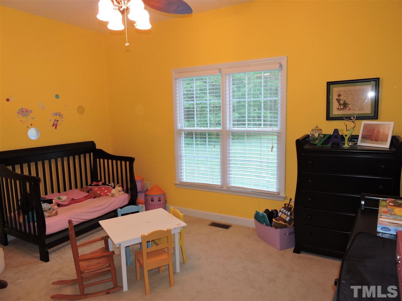 3360 Cates Mill Road Roxboro, NC 27574 - Photo 12 of 17 a bedroom with furniture and a window
