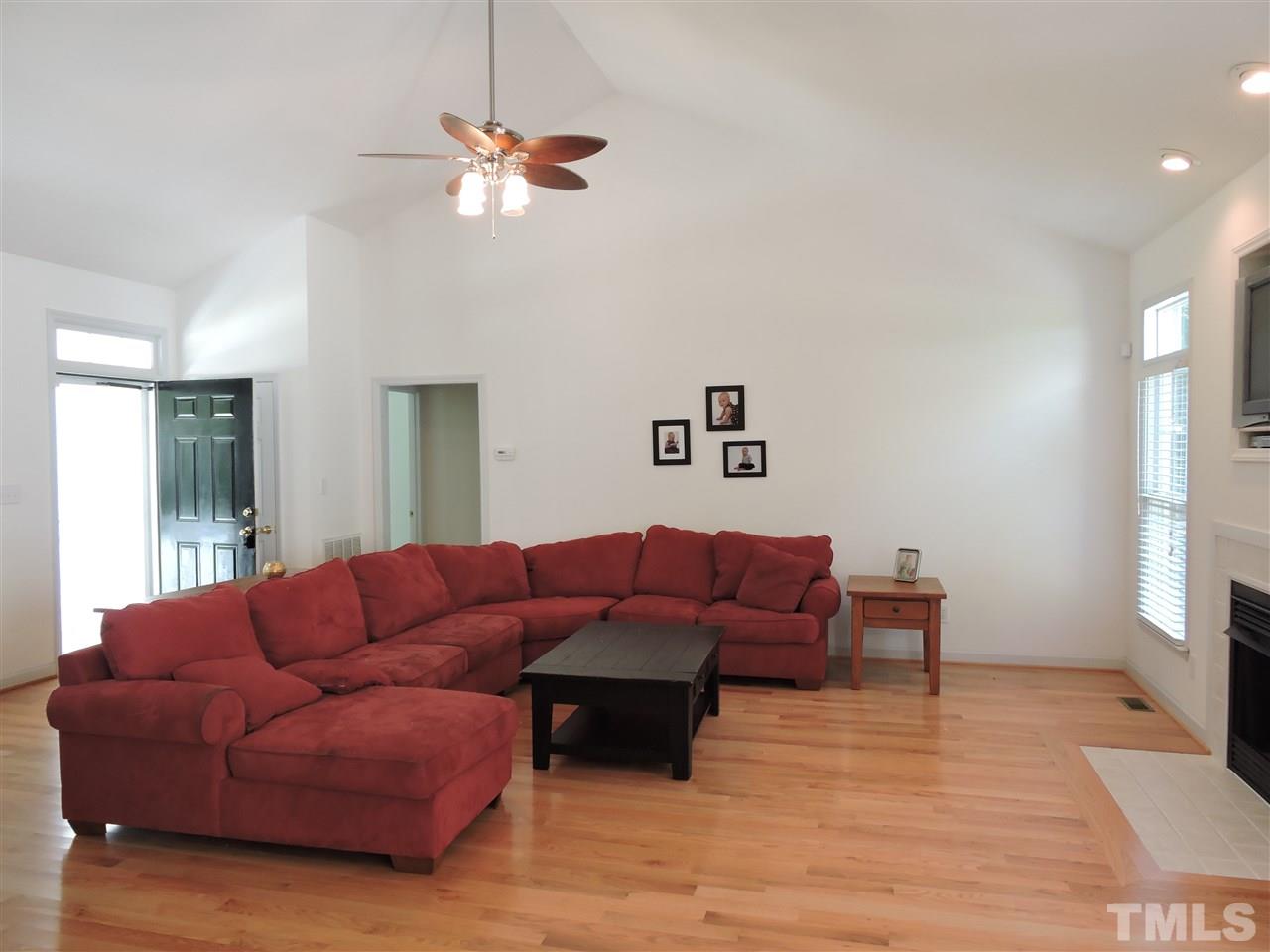 3360 Cates Mill Road Roxboro, NC 27574 - Photo 6 of 17 a living room with furniture and a chandelier