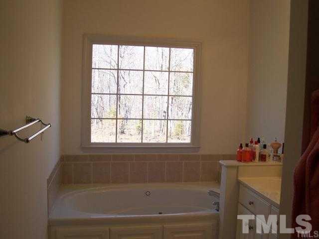 3360 Cates Mill Road Roxboro, NC 27574 - Photo 10 of 17 a bath tub sitting next to a window