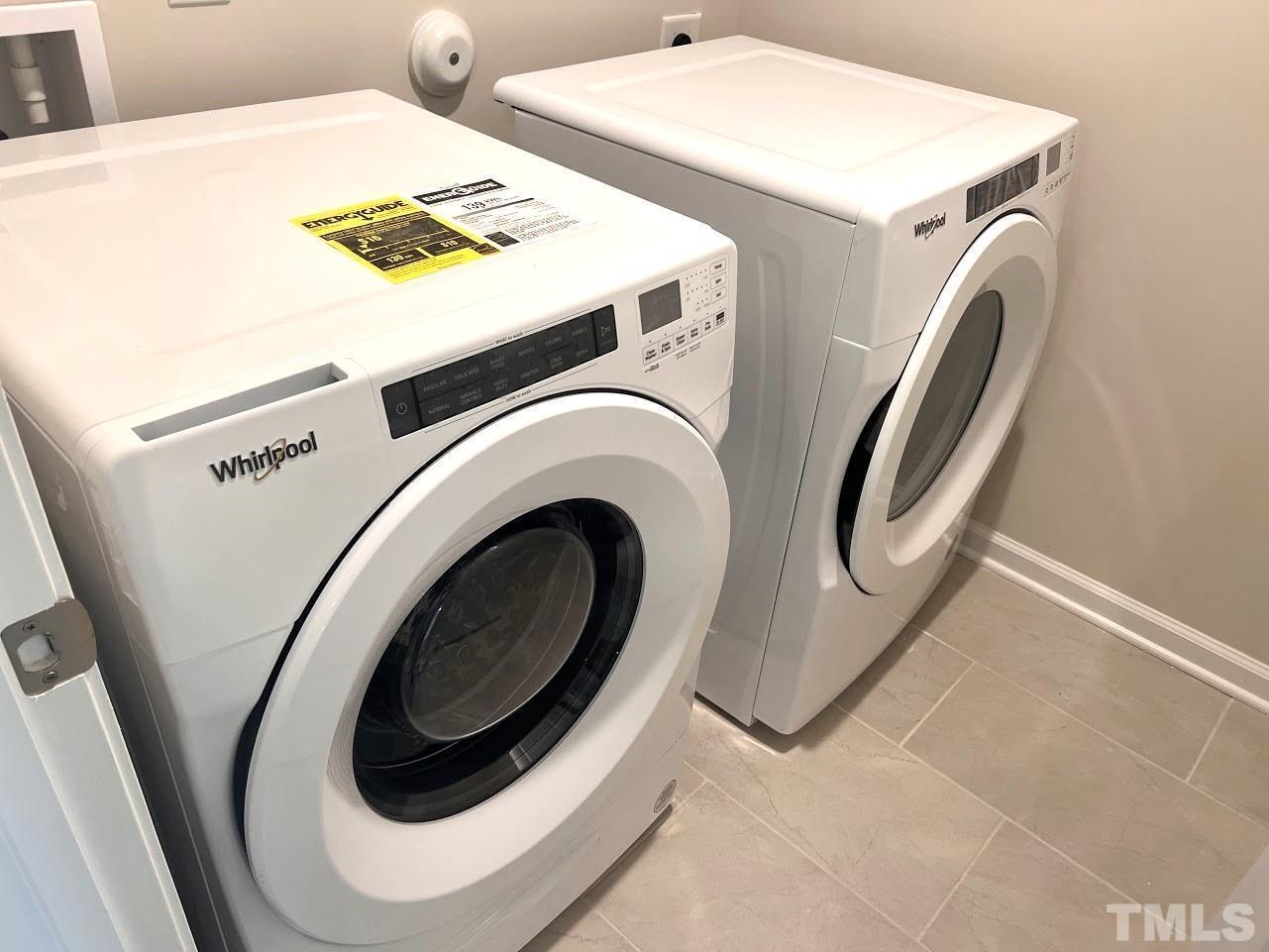 926 Field Ivy Drive Fuquay-Varina, NC 27526 - Photo 11 of 12 a utility room with dryer and washer