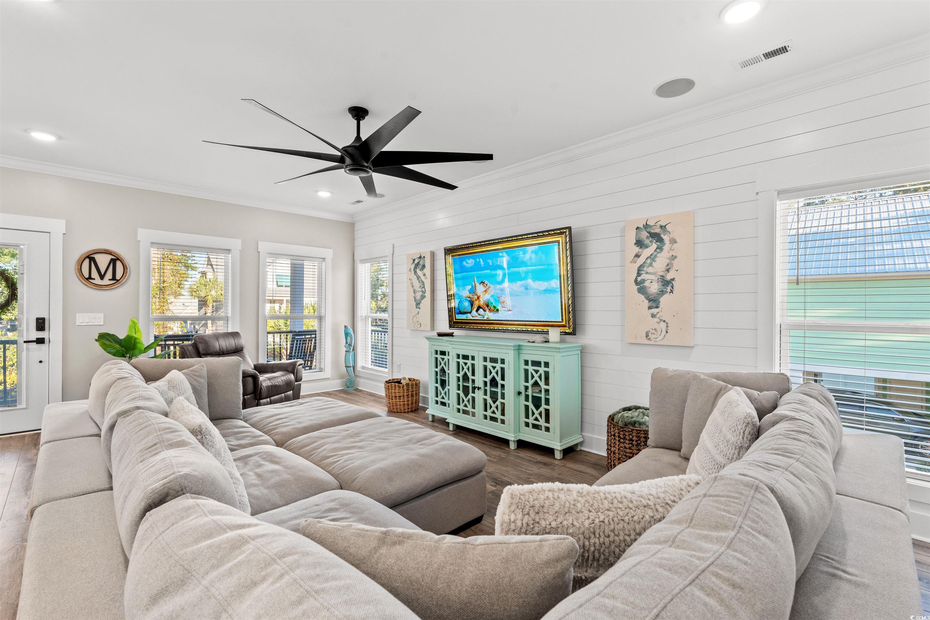 355 Oak Avenue Murrells Inlet, SC 29576 - Photo 8 of 34 Living area featuring recessed lighting, wood finished floors, visible vents, a ceiling fan, and crown molding