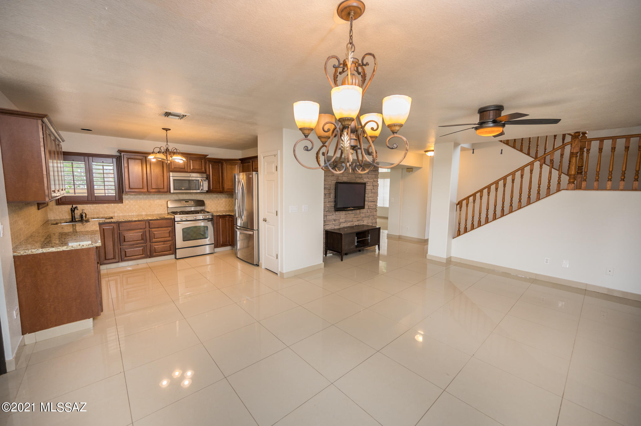 69 Highland Circle Rio Rico, AZ 85648 - Photo 11 of 49 a view of a livingroom with furniture and a kitchen
