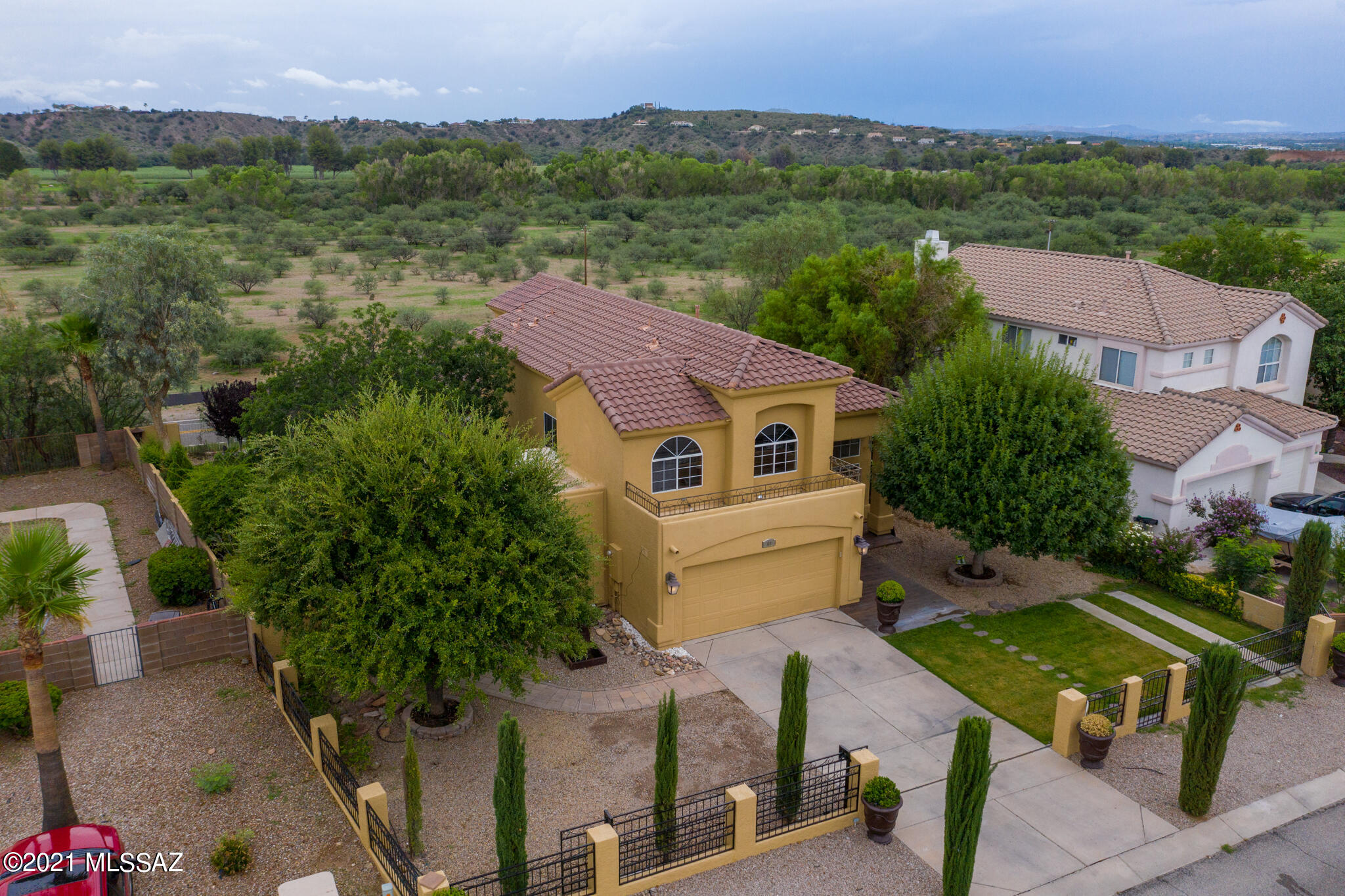 69 Highland Circle Rio Rico, AZ 85648 - Photo 3 of 49 an aerial view of a house with a garden