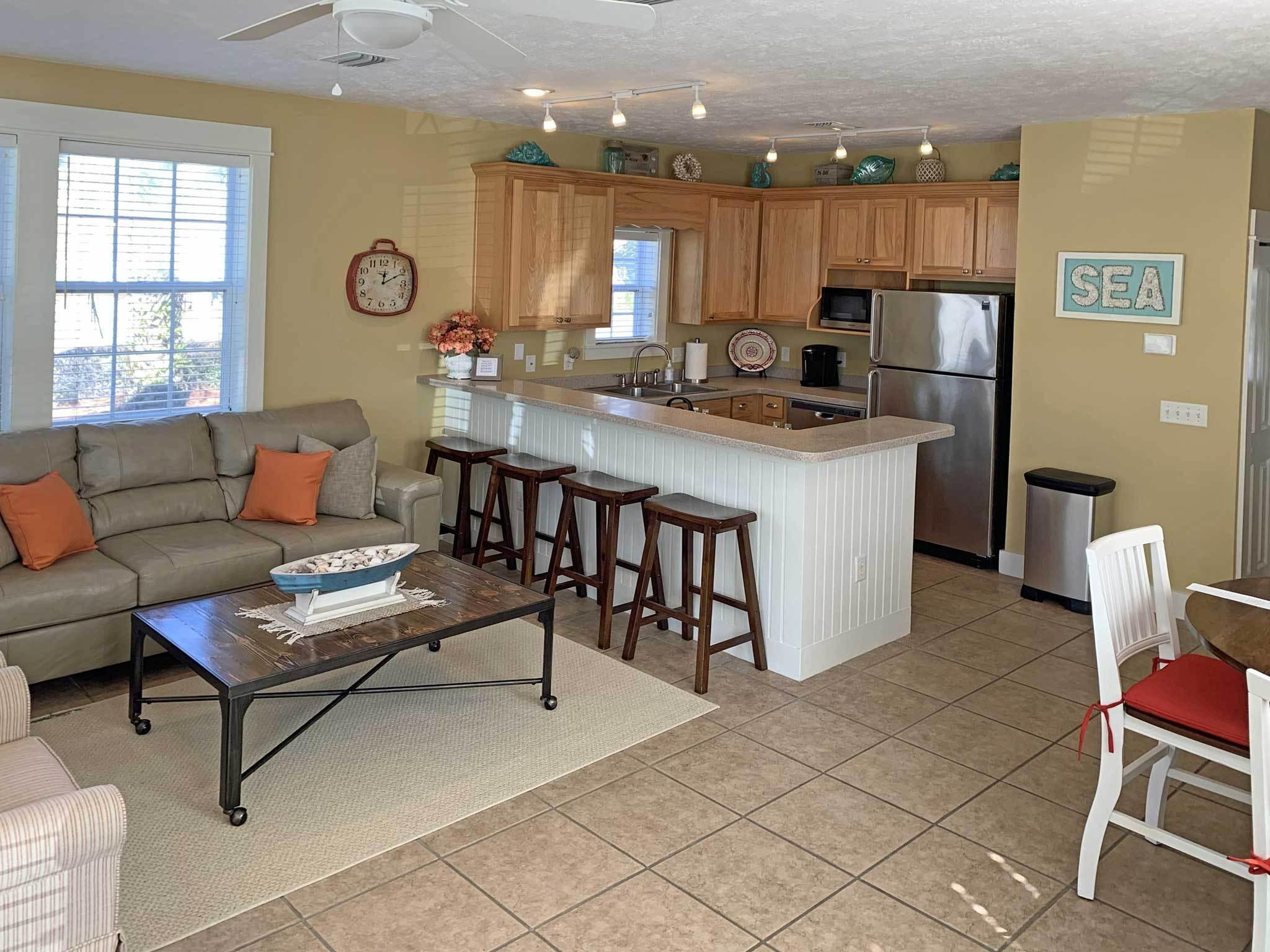 167 Beach Bike Way Inlet Beach, FL 32461 - Photo 3 of 22 a living room with granite countertop furniture a dining table and kitchen view