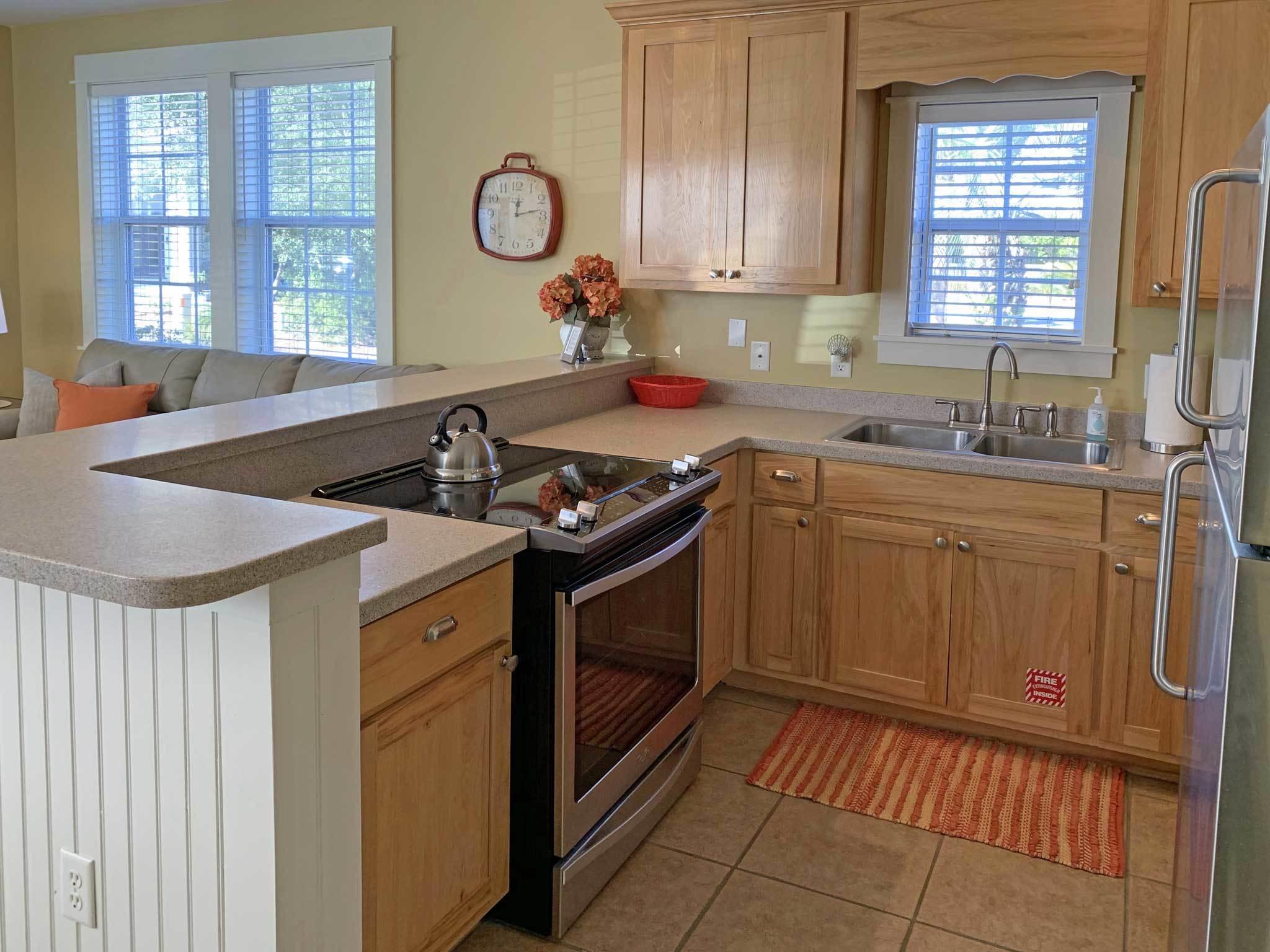 167 Beach Bike Way Inlet Beach, FL 32461 - Photo 5 of 22 a kitchen with stainless steel appliances granite countertop a sink stove and cabinets