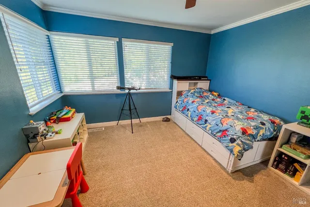 a bedroom with a bed and window