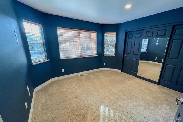 a bathroom with a sink a mirror a bathtub and a shower
