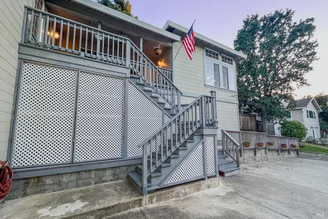 a view of a house with wooden stairs
