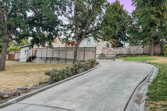 a backyard of a house with lots of green space