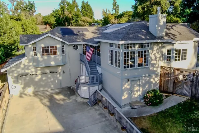 an aerial view of a house with outdoor space
