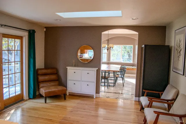 a living room with furniture and a window