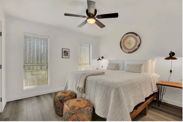 a dining room with stainless steel appliances kitchen island granite countertop furniture and a refrigerator
