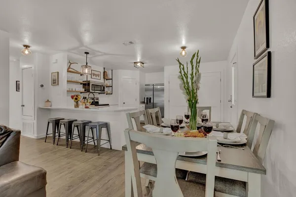 a view of dining room and kitchen island with furniture