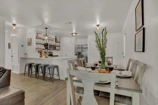 a view of dining room and kitchen island with furniture