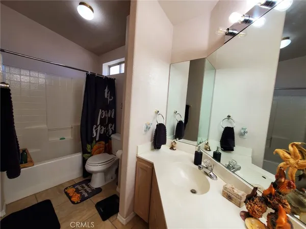 a view of a patio with table and chairs with wooden floor