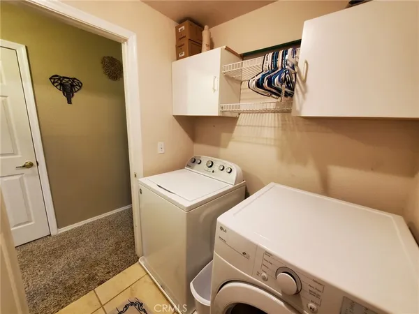 a view of a chairs and table in patio