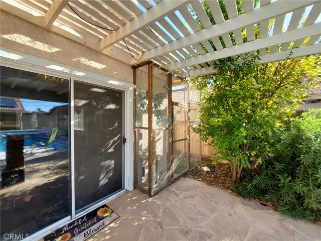 a living room with furniture and flowers