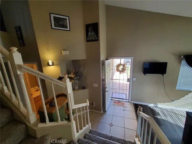 a living room with furniture a table and wooden floor