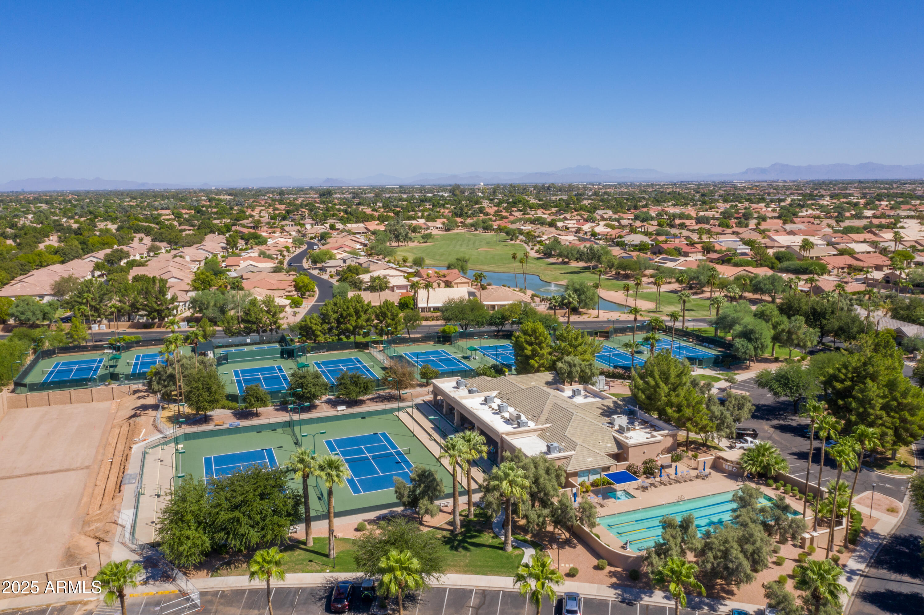 23745 South Vacation Way Sun Lakes, AZ 85248 - Photo 34 of 52 an aerial view of a city with lots of residential buildings ocean and mountain view in back