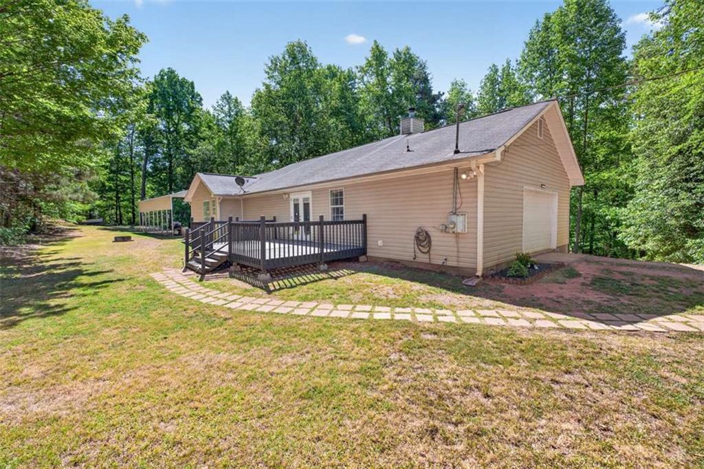 386 Ridgewood Drive Pendergrass, GA 30567 - Photo 39 of 50 a view of a house with yard and sitting area