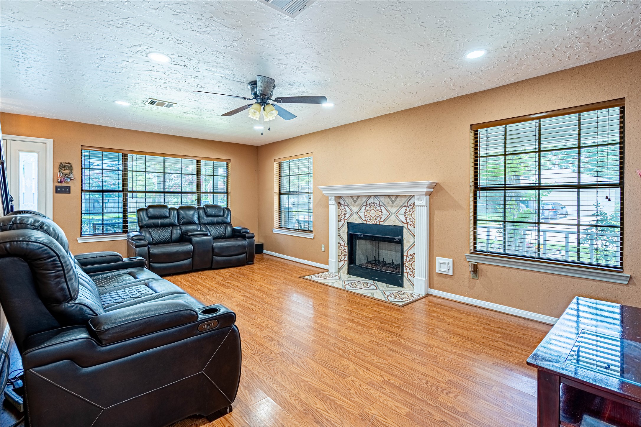 3403 Berry Grove Drive Spring, TX 77388 - Photo 18 of 43 a living room with furniture fireplace and a large window