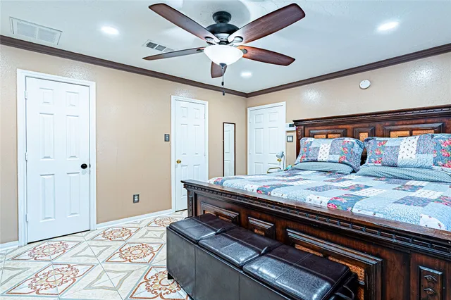 a bedroom with a bed and a dresser