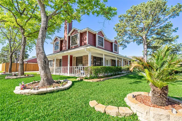 a front view of a house with a yard table and chairs