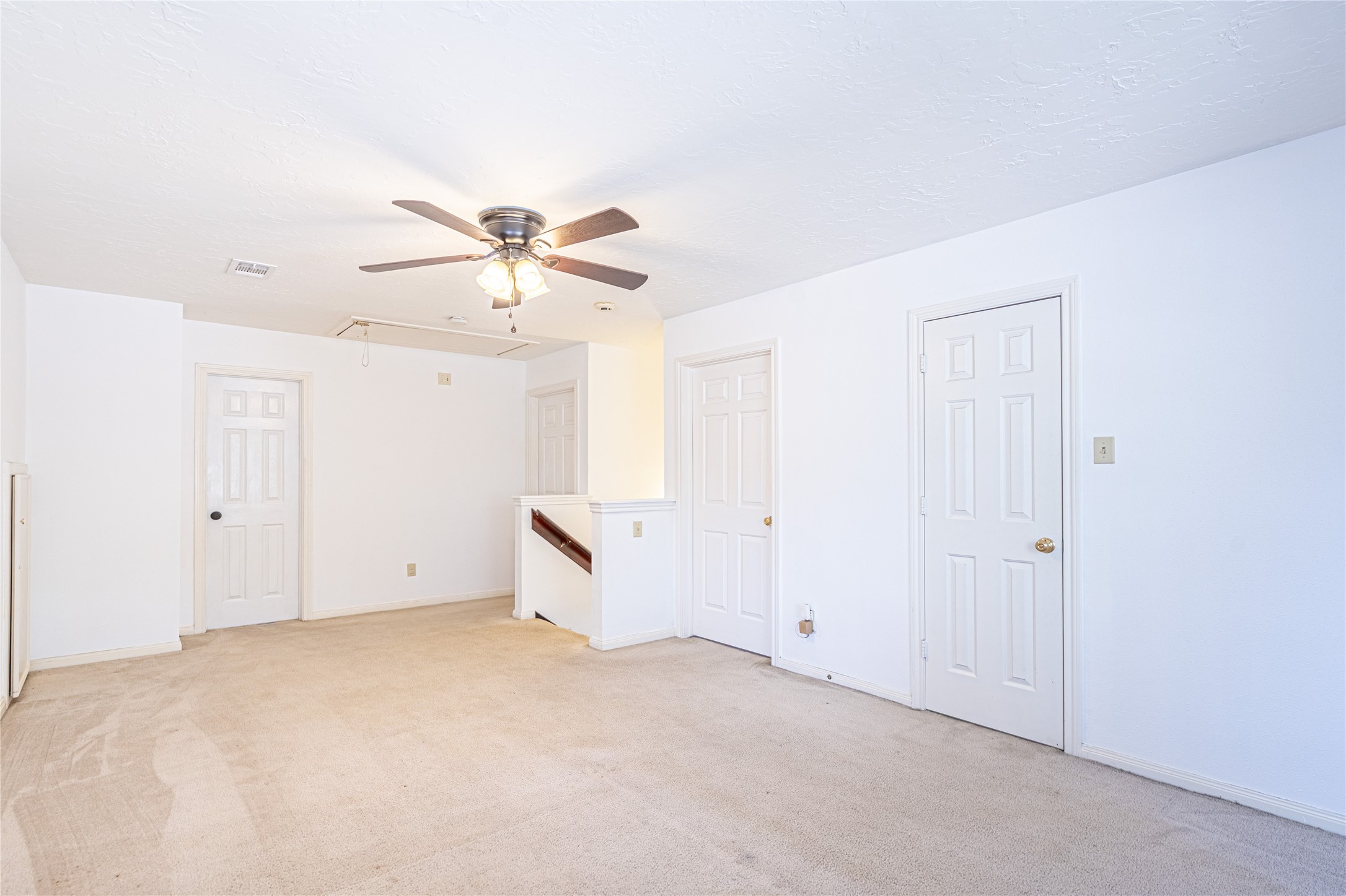 3403 Berry Grove Drive Spring, TX 77388 - Photo 28 of 43 an empty room with chandelier fan and windows