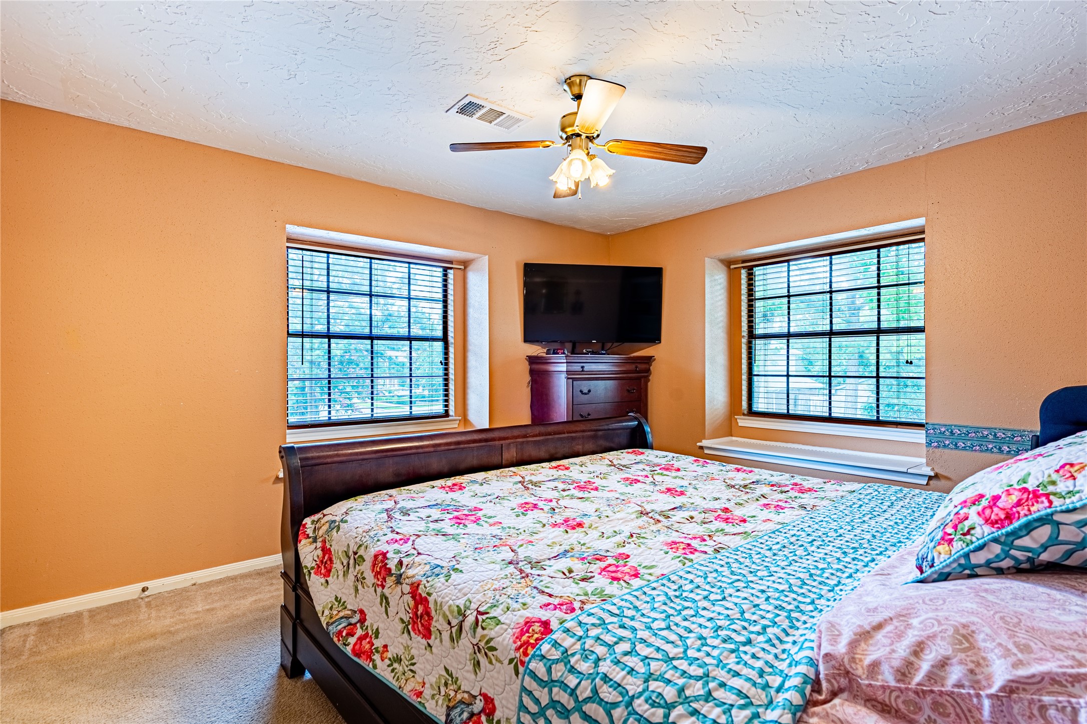 3403 Berry Grove Drive Spring, TX 77388 - Photo 29 of 43 a bedroom with a bed and a flat screen tv