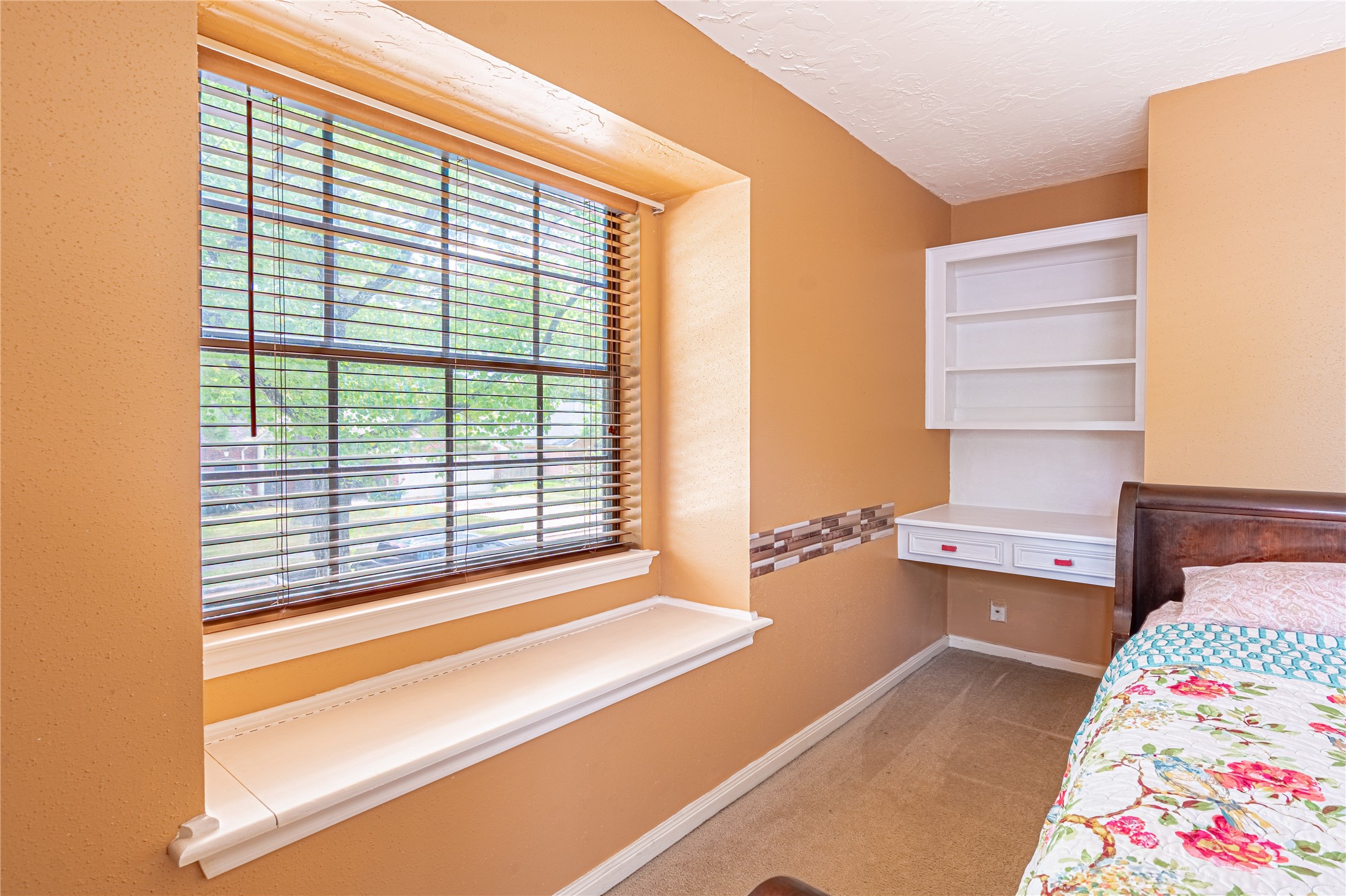 3403 Berry Grove Drive Spring, TX 77388 - Photo 30 of 43 a bedroom with a bed and a window