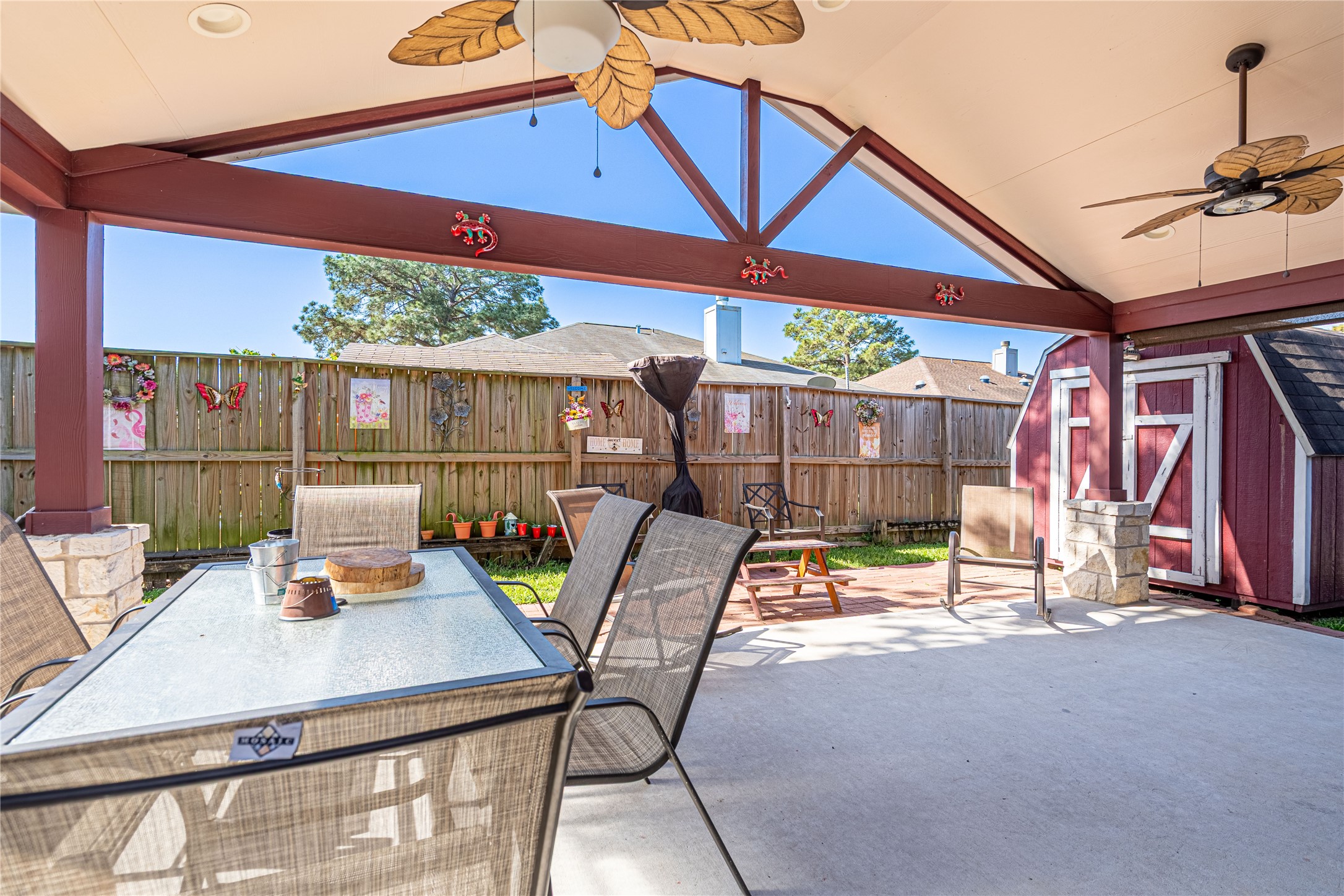 3403 Berry Grove Drive Spring, TX 77388 - Photo 38 of 43 a view of a patio with a table and chairs under an umbrella