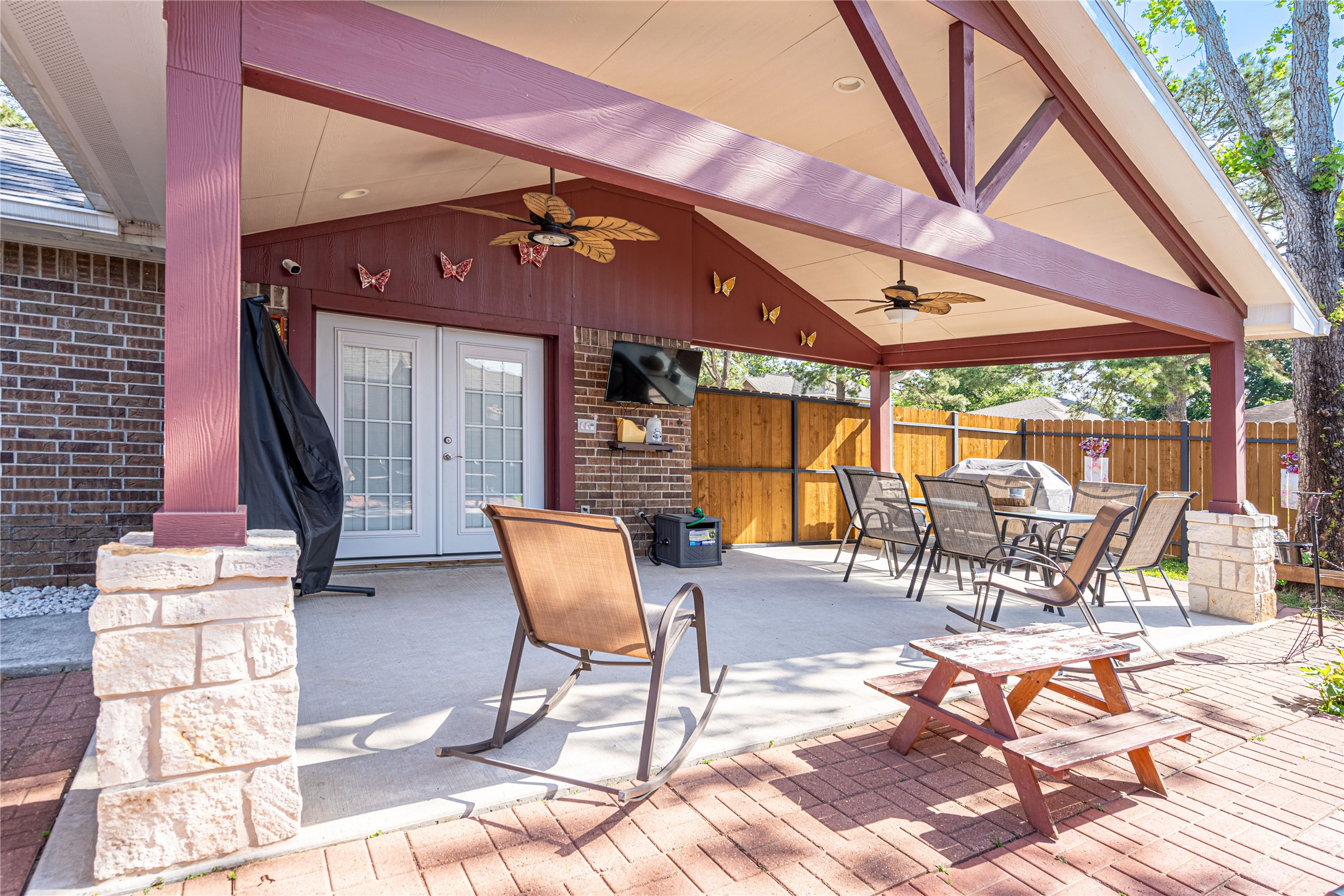 3403 Berry Grove Drive Spring, TX 77388 - Photo 39 of 43 a view of a patio with a table and chairs under an umbrella