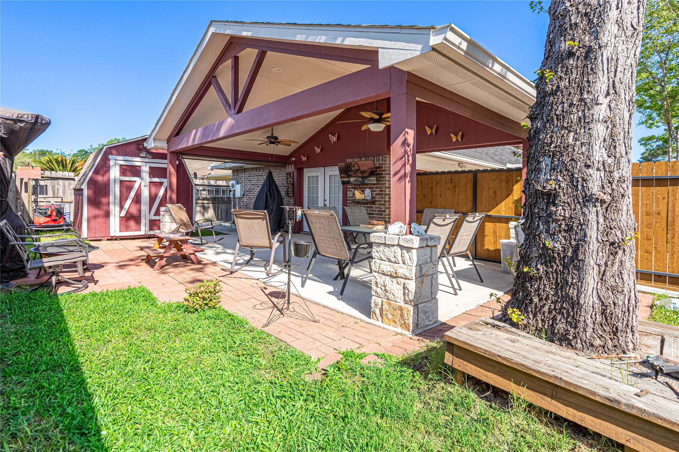 3403 Berry Grove Drive Spring, TX 77388 - Photo 40 of 43 a view of a chairs and table in back yard of the house