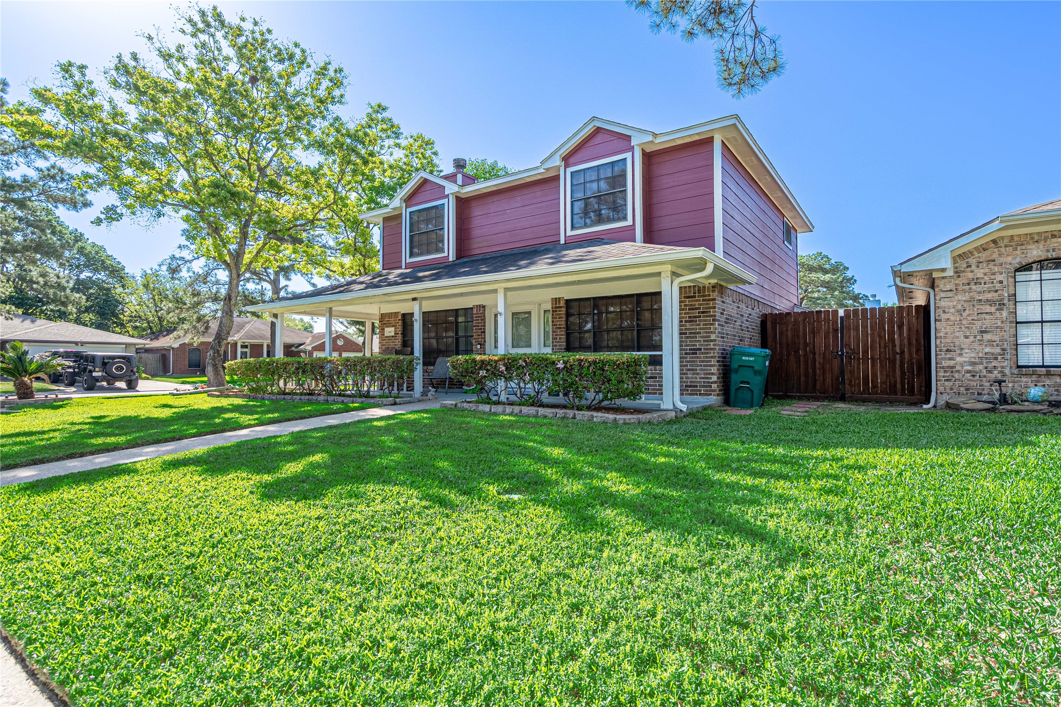 3403 Berry Grove Drive Spring, TX 77388 - Photo 6 of 43 a view of a house with a yard potted plants and a large tree