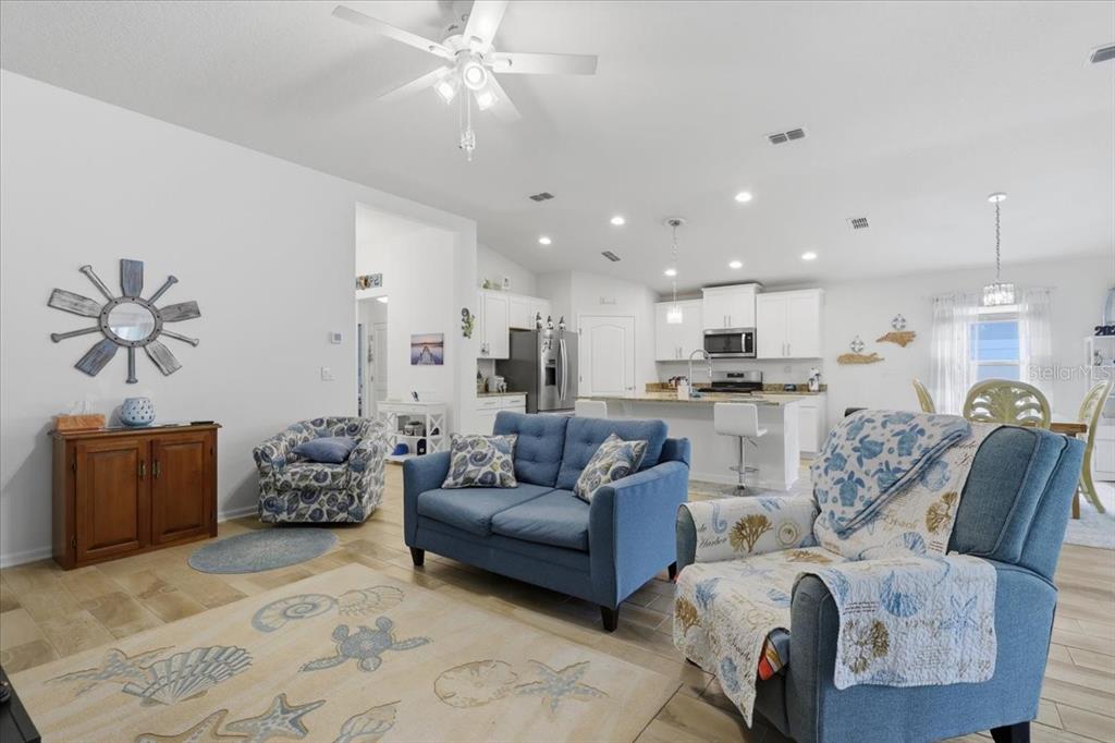 35 Birdie Way Bunnell, FL 32110 - Photo 8 of 57 a living room with furniture and kitchen view