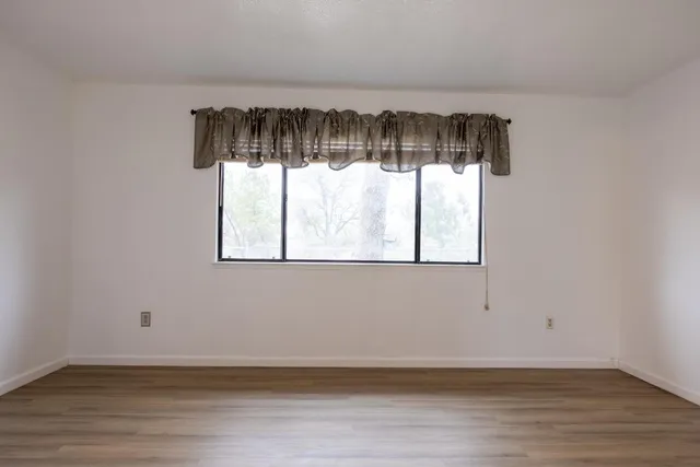 a bathroom with a sink toilet vanity and mirror