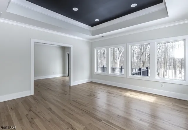 a spacious bedroom with a bed and a window
