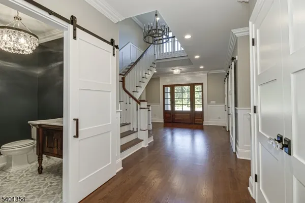 a view of entryway with wooden floor